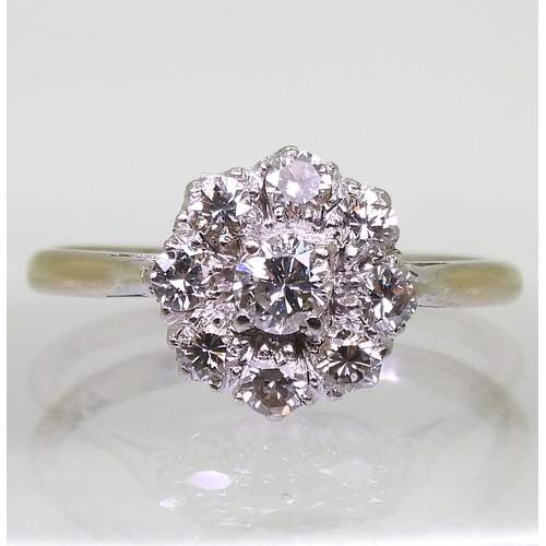 2777 - A DIAMOND FLOWER RINGthe classic galleried mount is set with estimated approx 0.80cts of brilliant c... 