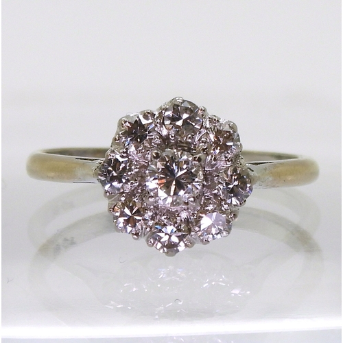 2777 - A DIAMOND FLOWER RINGthe classic galleried mount is set with estimated approx 0.80cts of brilliant c... 