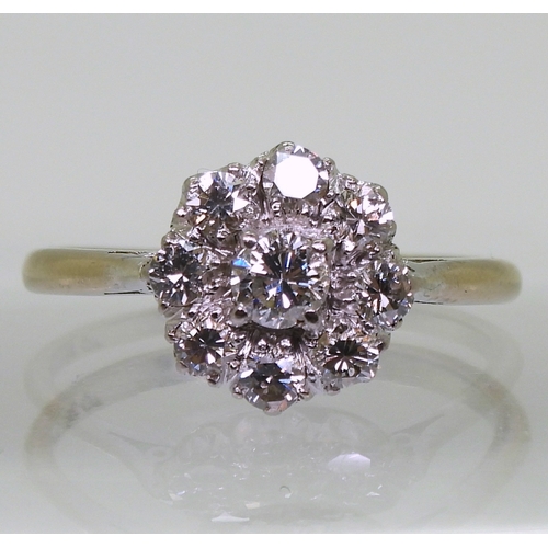 2777 - A DIAMOND FLOWER RINGthe classic galleried mount is set with estimated approx 0.80cts of brilliant c... 