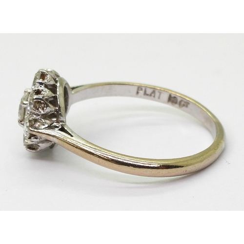 2777 - A DIAMOND FLOWER RINGthe classic galleried mount is set with estimated approx 0.80cts of brilliant c... 