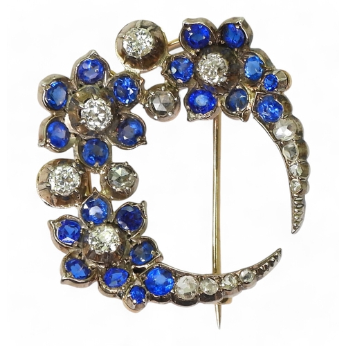 A FLOWER CRESCENT MOON BROOCH