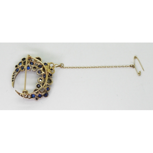 2780 - A FLOWER CRESCENT MOON BROOCHset with old and rose cut diamonds, with an estimated approx total diam... 