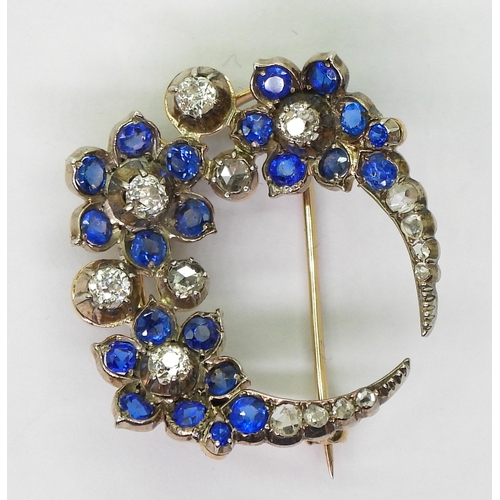 2780 - A FLOWER CRESCENT MOON BROOCHset with old and rose cut diamonds, with an estimated approx total diam... 