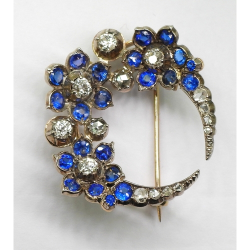 2780 - A FLOWER CRESCENT MOON BROOCHset with old and rose cut diamonds, with an estimated approx total diam... 