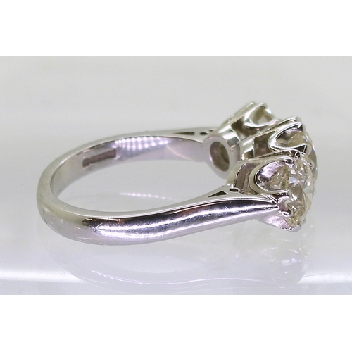 2783 - A SUBSTANTIAL THREE STONEdiamond ring. The classic galleried mount is in 18ct white gold, and set wi... 