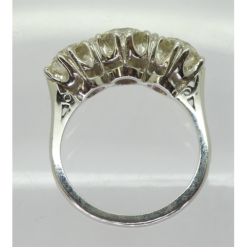 2783 - A SUBSTANTIAL THREE STONEdiamond ring. The classic galleried mount is in 18ct white gold, and set wi... 