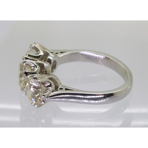 2783 - A SUBSTANTIAL THREE STONEdiamond ring. The classic galleried mount is in 18ct white gold, and set wi... 