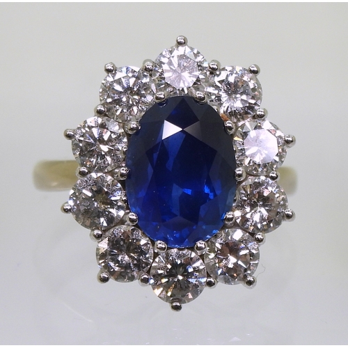 2786 - A CLASSIC SAPPHIRE & DIAMOND CLUSTER RINGthe mount in 18ct white gold and platinum, is set with ... 