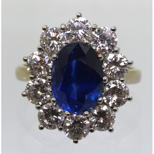 2786 - A CLASSIC SAPPHIRE & DIAMOND CLUSTER RINGthe mount in 18ct white gold and platinum, is set with ... 