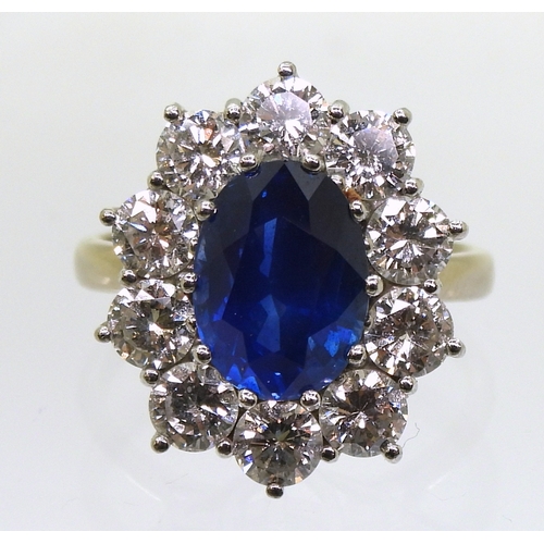 2786 - A CLASSIC SAPPHIRE & DIAMOND CLUSTER RINGthe mount in 18ct white gold and platinum, is set with ... 