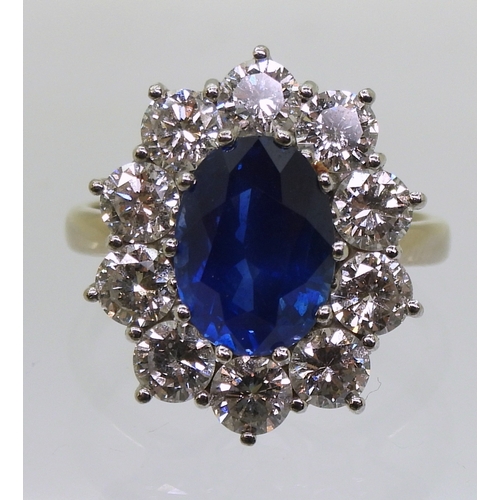 2786 - A CLASSIC SAPPHIRE & DIAMOND CLUSTER RINGthe mount in 18ct white gold and platinum, is set with ... 