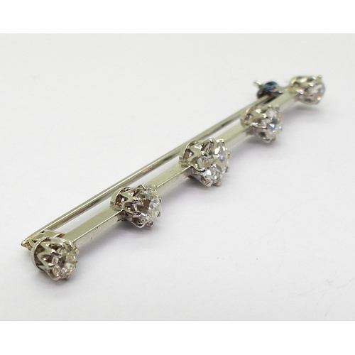 2788 - A FIVE STONE DIAMOND BAR BROOCHset with five old cut diamonds with an estimated approx diamond total... 