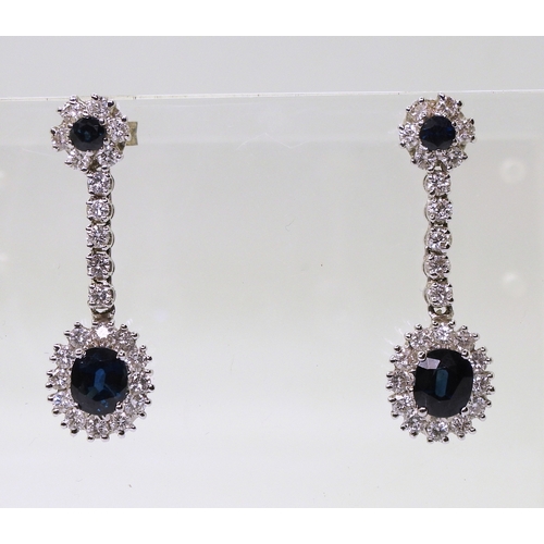 2793 - SAPPHIRE & DIAMOND DROP EARRINGSwith a oval cut sapphire of approx 6.4mm x 5.4mm x 3.6mm, diamet... 