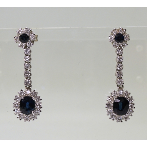 2793 - SAPPHIRE & DIAMOND DROP EARRINGSwith a oval cut sapphire of approx 6.4mm x 5.4mm x 3.6mm, diamet... 