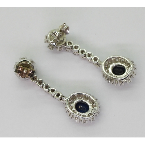 2793 - SAPPHIRE & DIAMOND DROP EARRINGSwith a oval cut sapphire of approx 6.4mm x 5.4mm x 3.6mm, diamet... 