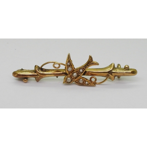 2795 - FOUR VINTAGE BROOCHESa bright yellow metal large bar brooch with a pearl studded dragonfly design, l... 