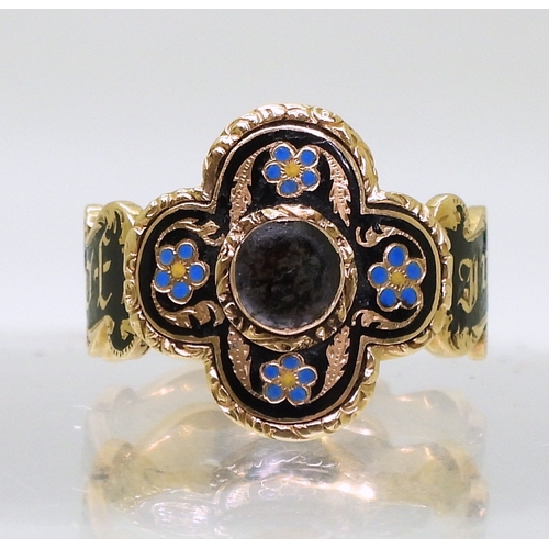 2798 - AN UNUSUAL MOURNING RINGwith bright yellow metal four lobed design. To the front with forget-me not ... 