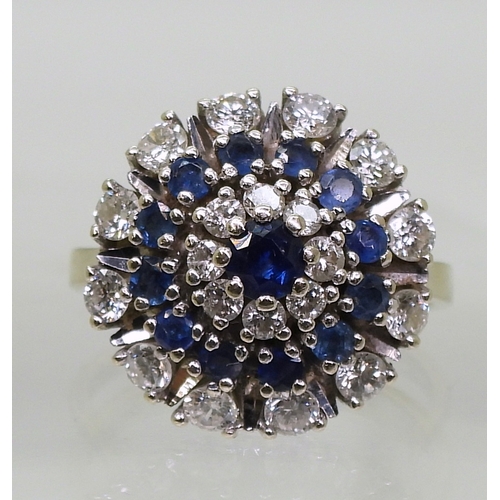 2799 - A SAPPHIRE & DIAMOND RINGthe classic cluster is mounted in 14k white gold, with a star burst des... 