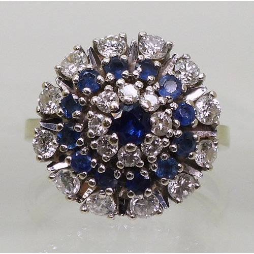 2799 - A SAPPHIRE & DIAMOND RINGthe classic cluster is mounted in 14k white gold, with a star burst des... 