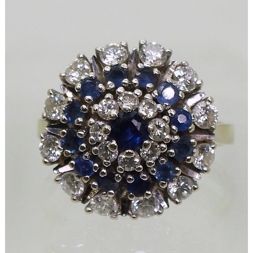 2799 - A SAPPHIRE & DIAMOND RINGthe classic cluster is mounted in 14k white gold, with a star burst des... 