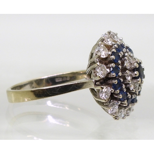 2799 - A SAPPHIRE & DIAMOND RINGthe classic cluster is mounted in 14k white gold, with a star burst des... 