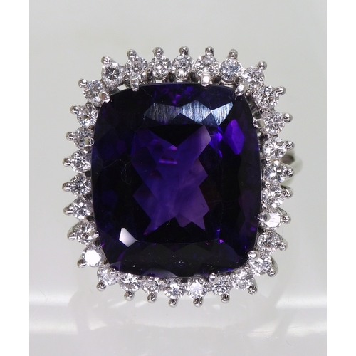 2801 - AMETHYST & DIAMOND RINGset in 18k white gold classic basket mount with a large cushion cut ameth... 