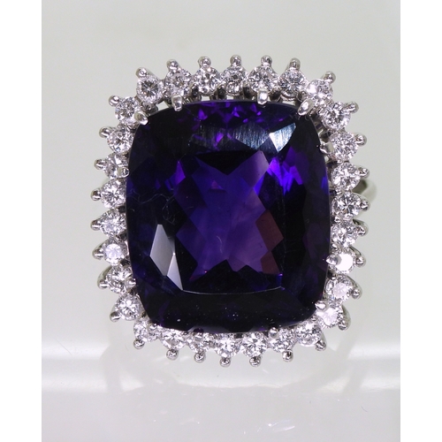 2801 - AMETHYST & DIAMOND RINGset in 18k white gold classic basket mount with a large cushion cut ameth... 