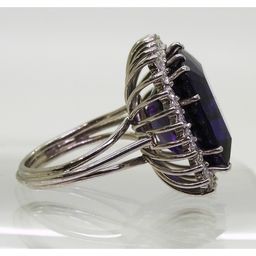 2801 - AMETHYST & DIAMOND RINGset in 18k white gold classic basket mount with a large cushion cut ameth... 