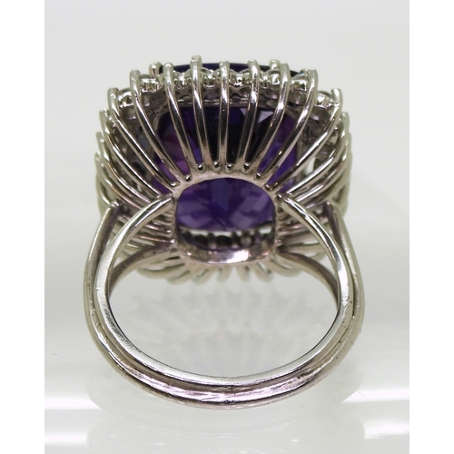 2801 - AMETHYST & DIAMOND RINGset in 18k white gold classic basket mount with a large cushion cut ameth... 