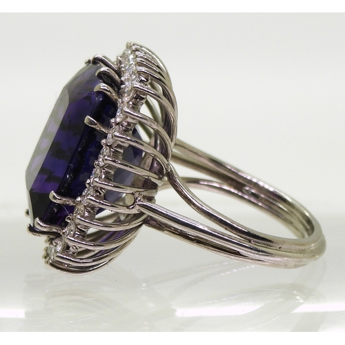 2801 - AMETHYST & DIAMOND RINGset in 18k white gold classic basket mount with a large cushion cut ameth... 