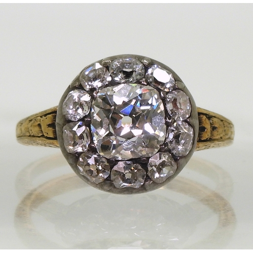 2802 - AN ANTIQUE DIAMOND RINGset with a cushion cut diamond of estimated approx 1.30cts surrounded with te... 