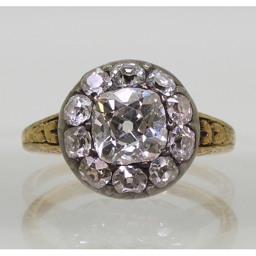 2802 - AN ANTIQUE DIAMOND RINGset with a cushion cut diamond of estimated approx 1.30cts surrounded with te... 