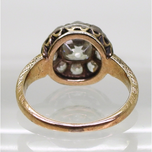 2802 - AN ANTIQUE DIAMOND RINGset with a cushion cut diamond of estimated approx 1.30cts surrounded with te... 