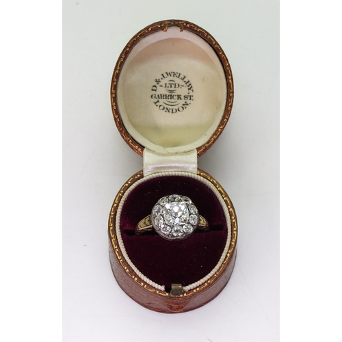 2802 - AN ANTIQUE DIAMOND RINGset with a cushion cut diamond of estimated approx 1.30cts surrounded with te... 