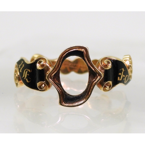 2804 - A MOURNING RING MOUNTmade in bright yellow metal the scrolled ribbon pattern mount is enamelled in b... 