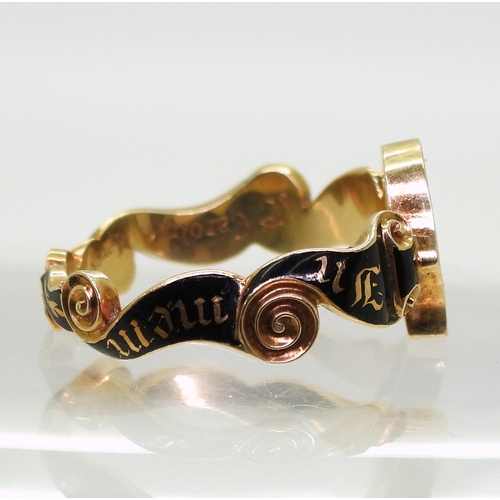 2804 - A MOURNING RING MOUNTmade in bright yellow metal the scrolled ribbon pattern mount is enamelled in b... 