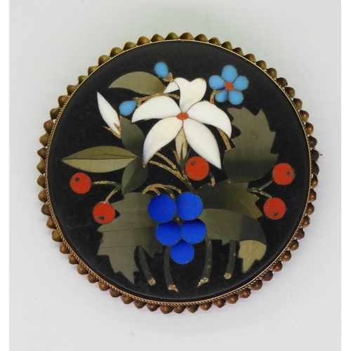 2808 - A PIETRA DURA BROOCHthe floral themed brooch is inlaid with various hardstones and shells, diameter ... 