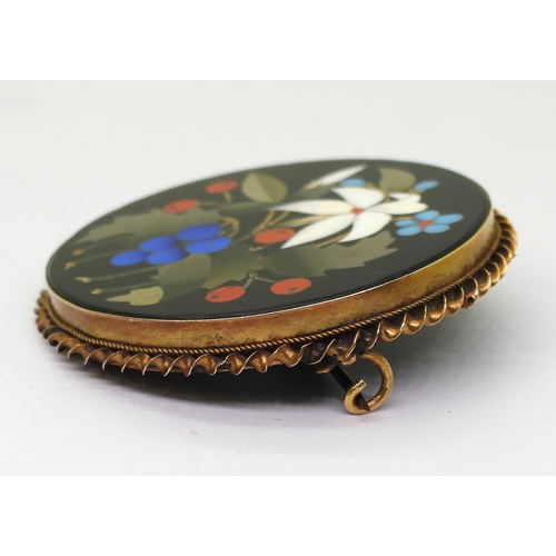 2808 - A PIETRA DURA BROOCHthe floral themed brooch is inlaid with various hardstones and shells, diameter ... 