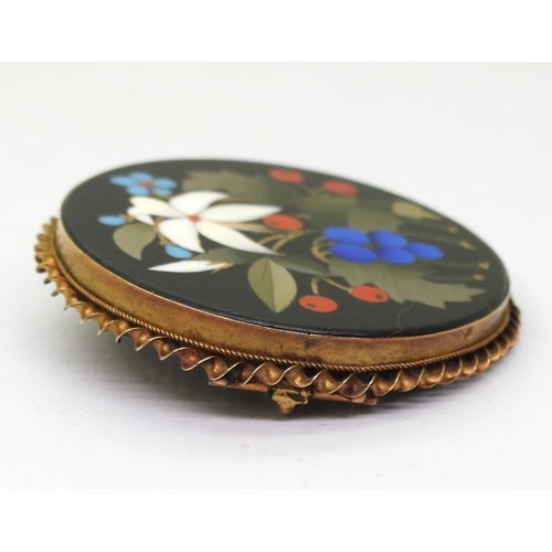 2808 - A PIETRA DURA BROOCHthe floral themed brooch is inlaid with various hardstones and shells, diameter ... 