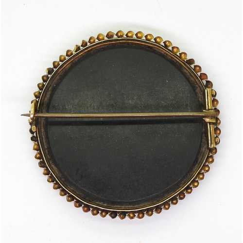 2808 - A PIETRA DURA BROOCHthe floral themed brooch is inlaid with various hardstones and shells, diameter ... 