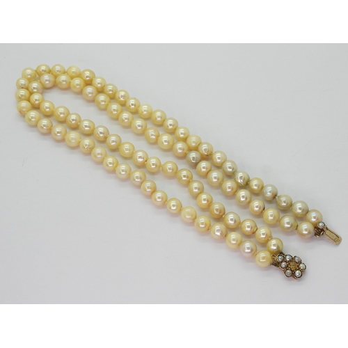 2809 - BAROQUE PEARLSa double string necklace with a 9ct gold citrine and pearl set decorative clasp. Short... 