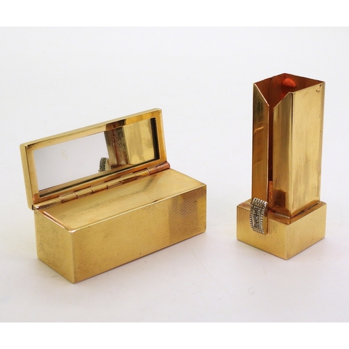 2810 - A DECORATIVE LIPSTICK COMPACTmade in 18k (stamped 750,) gold with all over engine turned linear engr... 