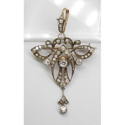 2816 - A DIAMOND EDWARDIAN PENDANTthe yellow and white metal mount is set with estimated approx 1.10cts of ... 