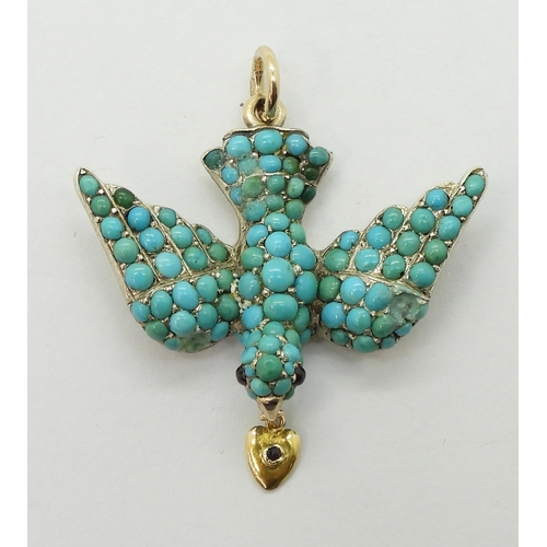 2817 - A TURQUOISE BIRD PENDANTthe yellow and white metal mount is set throughout with turquoise, with red ... 