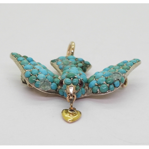 2817 - A TURQUOISE BIRD PENDANTthe yellow and white metal mount is set throughout with turquoise, with red ... 