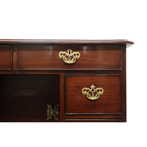 2059 - A GEORGE II WALNUT LADIES KNEEHOLE DESKwith rectangular crossbanded top over two long drawers over t... 