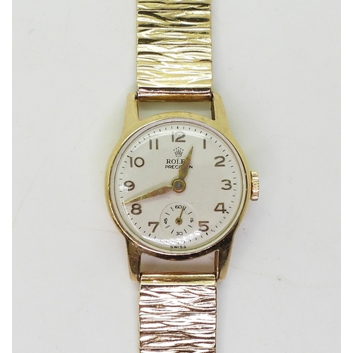 2891 - A 9CT LADIES ROLEX PRECISIONwith cream dial gold coloured Arabic numerals and hands, together with a... 