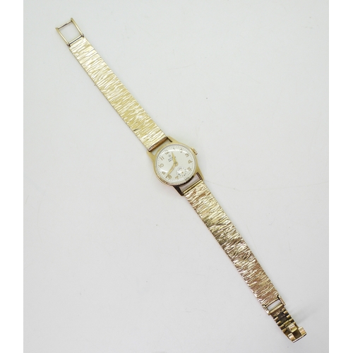 2891 - A 9CT LADIES ROLEX PRECISIONwith cream dial gold coloured Arabic numerals and hands, together with a... 