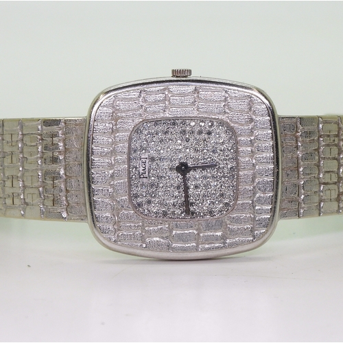 2893 - A RETRO DIAMOND SET PIAGETwith crocodile skin textured bezel and strap, the dial set with pave set d... 