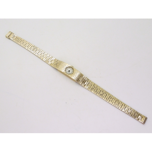 2897 - A 9CT GOLD RETRO WATCHthe dial marked Berkeley Swiss, with black baton, numerals and hands. Hallmark... 